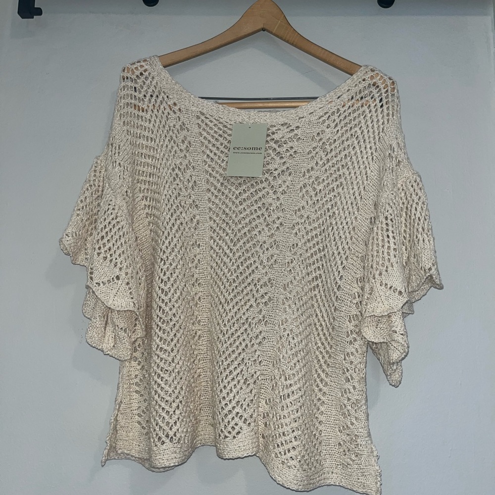 NWT Eesome cream boat neck, off the shoulder crochet short ruffled sleeve.